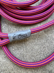 The Sandor Long Line - We custom braided our purple and tangerine rope to create this beautiful, 15' long line. The keeper is Latigo leather. The termination is tumbled aluminum swaged by hydraulic machine, covered in custom polyolefin sleeves that exceed maximum break strength requirements in the industry. The rope yarn is color fast. 